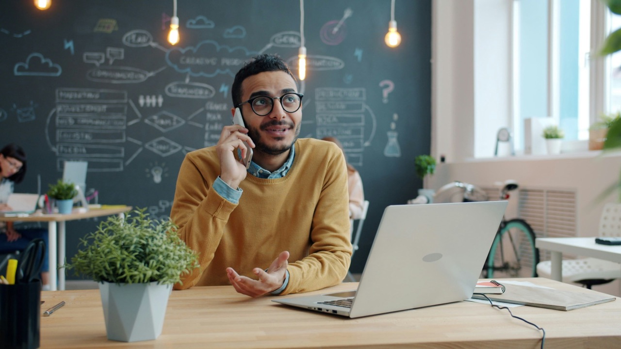An entrepreneur at his laptop talking through his funding plans